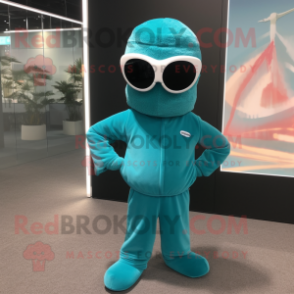 Teal Candy Box mascot costume character dressed with a Jumpsuit and Sunglasses