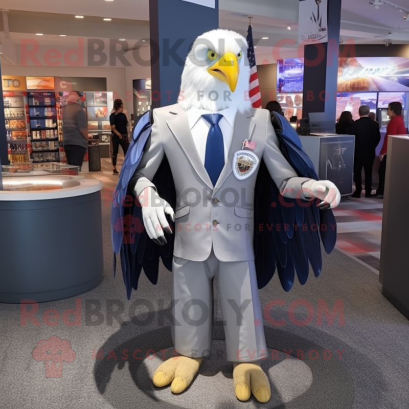 Silver Bald Eagle mascot costume character dressed with a Blazer and Lapel pins Silver Bald Eagle mascot costume character dressed with a Blazer and Lapel pins