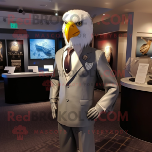 Silver Bald Eagle mascot costume character dressed with a Blazer and Lapel pins