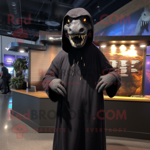 Black Tyrannosaurus mascot costume character dressed with a Hoodie and Shawl pins