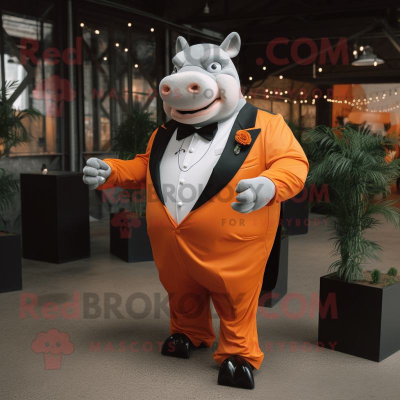 Orange Rhinoceros mascot costume character dressed with a Tuxedo and Rings Orange Rhinoceros mascot costume character dressed with a Tuxedo and Rings