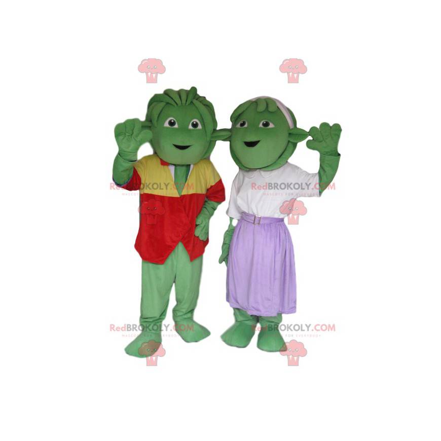 Duo mascotte di creature verdi molto allegro e ben vestito -