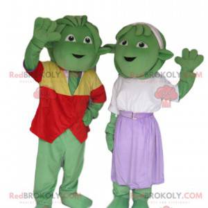 Mycket glad och välklädd grön varelse maskot duo -