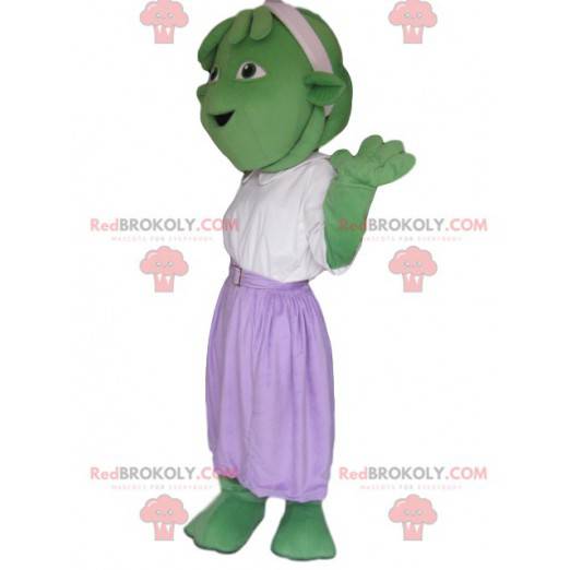 Criatura mascote verde com saia roxa - Redbrokoly.com