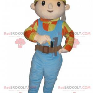 Handwerker-Maskottchen mit blauem Overall und gelbem Helm -