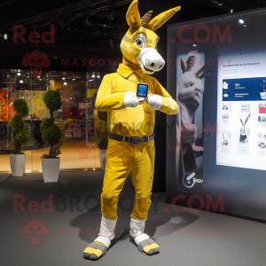 Gold Donkey mascot costume character dressed with a Skinny Jeans and Smartwatches