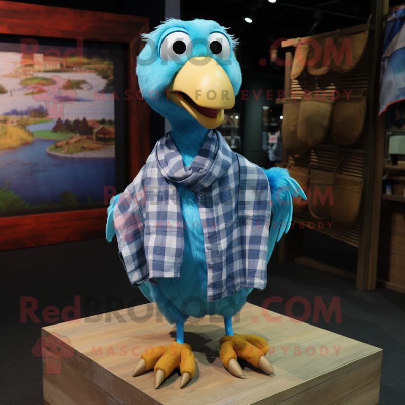 Cyan Dodo Bird mascot costume character dressed with a Flannel Shirt and Shawl pins