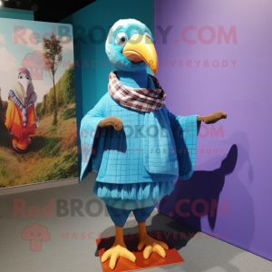 Cyan Dodo Bird mascot costume character dressed with a Flannel Shirt and Shawl pins