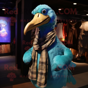 Cyan Dodo Bird mascot costume character dressed with a Flannel Shirt and Shawl pins