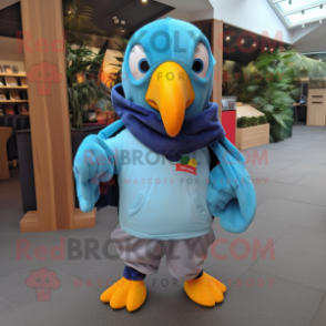 Sky Blue Toucan mascot costume character dressed with a Hoodie and Pocket squares