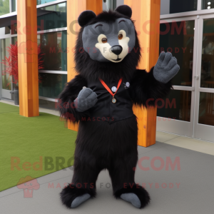 Black Marmot mascot costume character dressed with a Flare Jeans and Tie pins