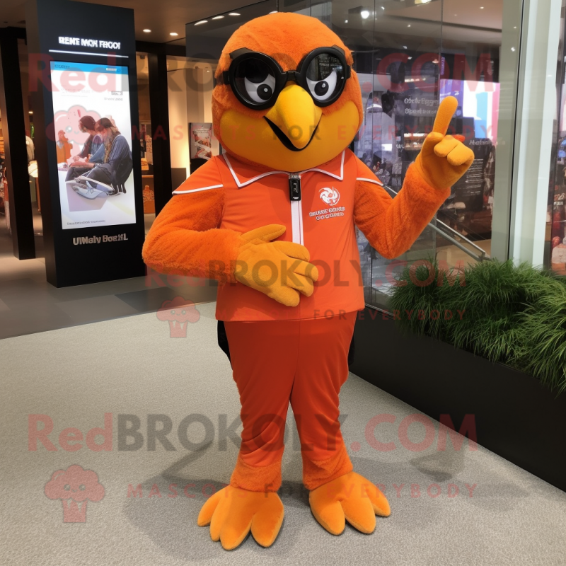 Orange Falcon mascot costume character dressed with a Jumpsuit and Bracelet watches Orange Falcon mascot costume character dressed with a Jumpsuit and Bracelet watches