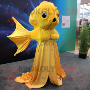 Gold Betta Fish mascot costume character dressed with a A-Line Dress and Shawl pins