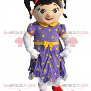 Mascote fada com vestido roxo com bolinhas amarelas -