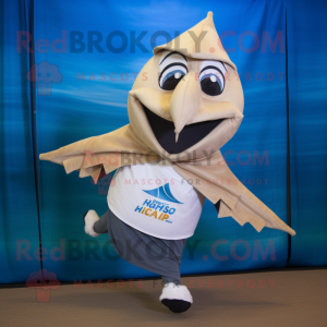 Tan Swordfish mascot costume character dressed with a Running Shorts and Shawl pins