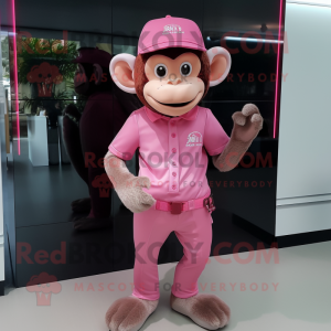 Pink Monkey mascot costume character dressed with a Polo Shirt and Caps