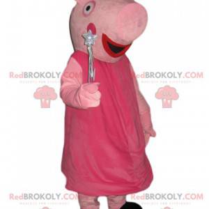 Mascotte Peppa Pig con una corona d'argento e una bacchetta