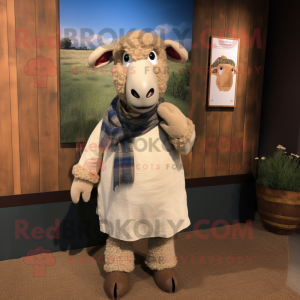 Tan Sheep mascot costume character dressed with a Chambray Shirt and Shawl pins