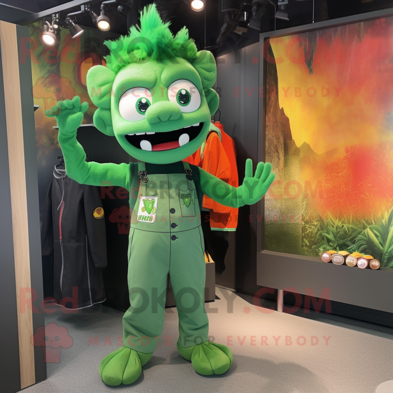 Green Fire Eater mascot costume character dressed with a Overalls and Tote bags