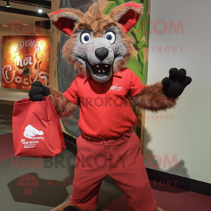 Red Hyena mascot costume character dressed with a Dress Shirt and Tote bags