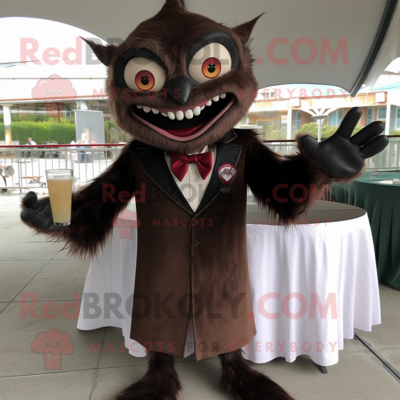 Brown Vampire mascot costume character dressed with a Cocktail Dress and Lapel pins Brown Vampire mascot costume character dressed with a Cocktail Dress and Lapel pins
