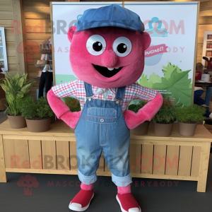 Pink Raspberry mascot costume character dressed with a Chambray Shirt and Headbands