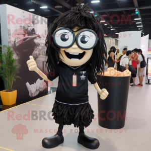 Black Pad Thai mascot costume character dressed with a Graphic Tee and Eyeglasses