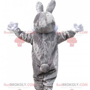 Gray and white rabbit mascot with a broad smile - Redbrokoly.com