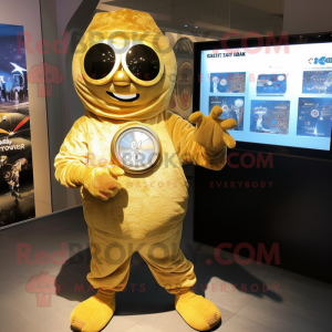 Gold Shakshuka mascot costume character dressed with a Sweatshirt and Digital watches