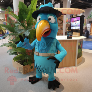 Turquoise Toucan mascot costume character dressed with a Overalls and Tie pins
