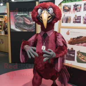 Maroon Vulture mascot costume character dressed with a Oxford Shirt and Earrings