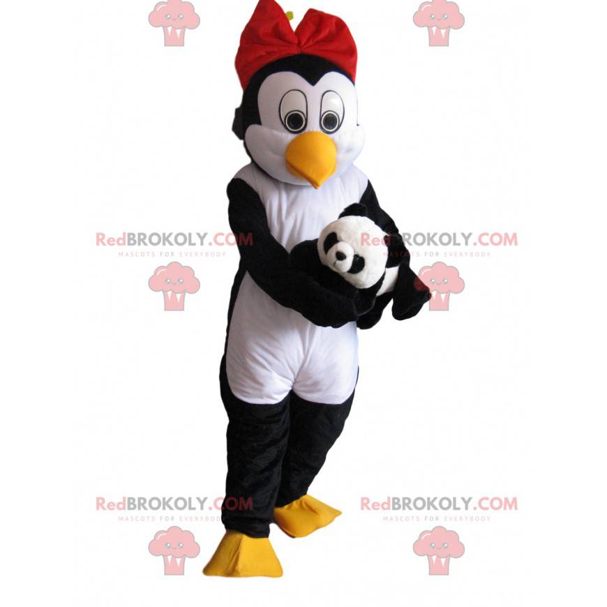 Penguin mascot with a red bow tie and a soft toy -