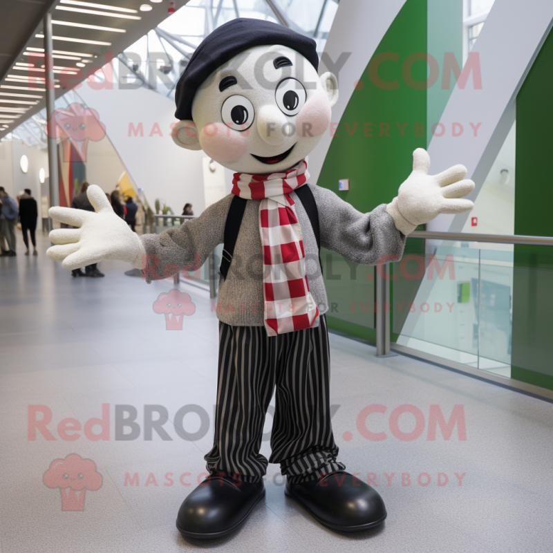 Olive Mime mascot costume character dressed with a Oxford Shirt and Scarves