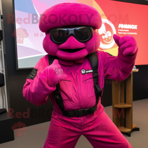 Magenta Para Commando mascot costume character dressed with a Jumpsuit and Sunglasses