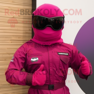 Magenta Para Commando mascot costume character dressed with a Jumpsuit and Sunglasses