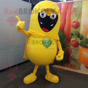 Yellow Pepper mascot costume character dressed with a Jumpsuit and Tie pins