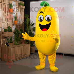 Yellow Pepper mascot costume character dressed with a Jumpsuit and Tie pins