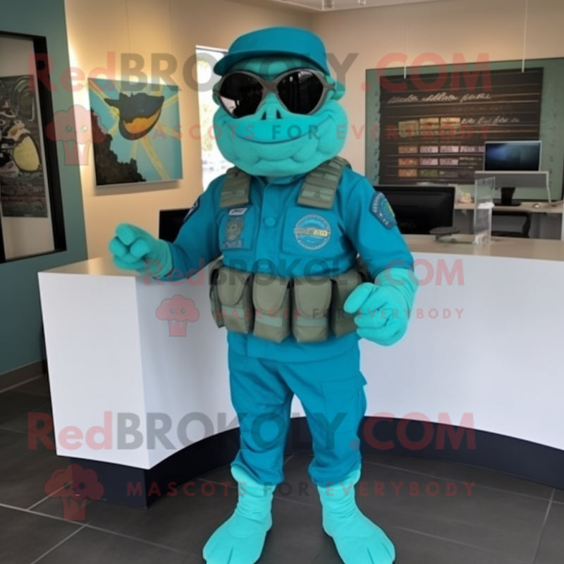 Turquoise Marine Recon mascot costume character dressed with a Graphic Tee and Headbands