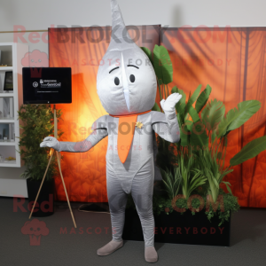 Silver Carrot mascot costume character dressed with a Bodysuit and Lapel pins