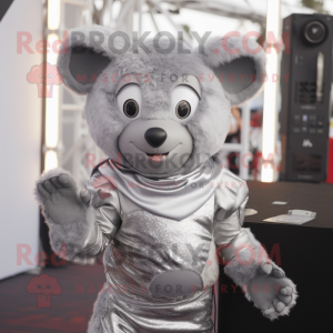 Silver But mascot costume character dressed with a Playsuit and Mittens