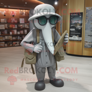Gray Squid mascot costume character dressed with a Cargo Pants and Reading glasses
