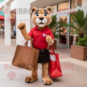Red Mountain Lion mascot costume character dressed with a Pencil Skirt and Tote bags