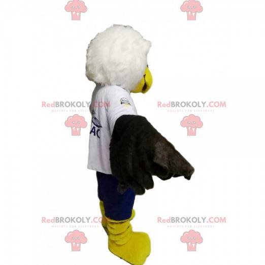 White and black golden eagle mascot with blue shorts -