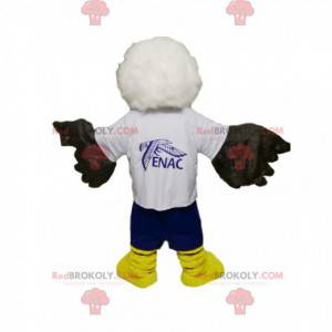 White and black golden eagle mascot with blue shorts -