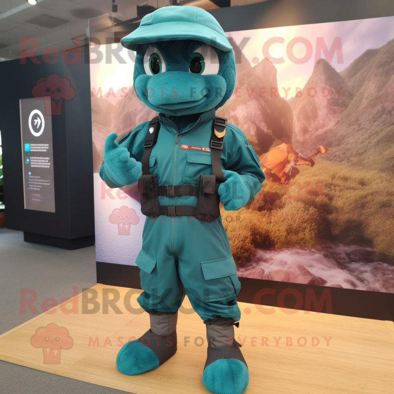 Teal Para Commando mascot costume character dressed with a Romper and Pocket squares Teal Para Commando mascot costume character dressed with a Romper and Pocket squares