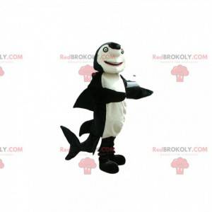 Mascotte de requin noir et blanc avec des yeux verts -