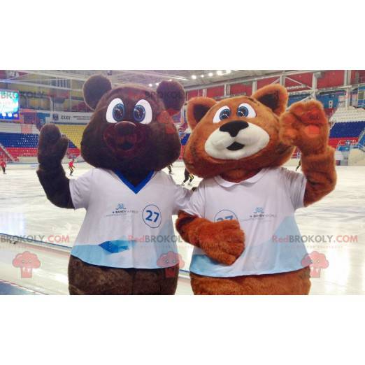 2 maskotar en brun björn och en orange och vit räv -