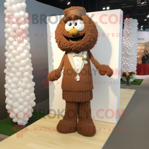 Brown Meatballs mascot costume character dressed with a Wedding Dress and Tie pins