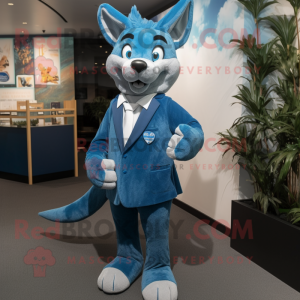 Blue Dingo mascot costume character dressed with a Suit Jacket and Clutch bags