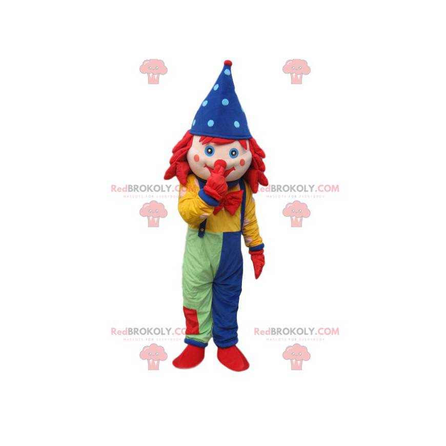 Clown-Maskottchen mit Overall und blauem, spitzem Hut -